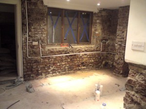 Wiring protected before damp proofing.