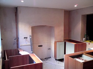 Plaster skim over damp proofing.
